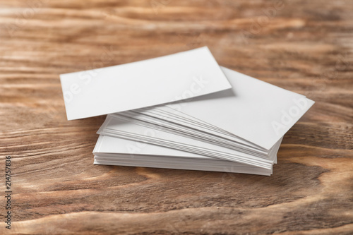 Blank business cards on wooden background