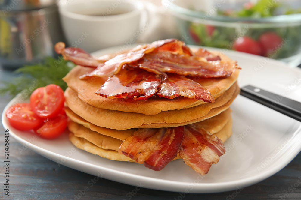 Plate with tasty pancakes and bacon on table, closeup Plate with tasty pancakes and bacon on table, closeup