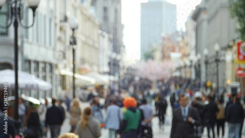 Anonymous crowd of people walking on Arbat street in Moscow slow motion photo