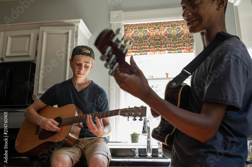 Photos Two Teeenage Boys Jamming with Guitars after school