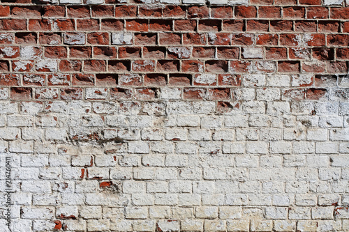 Old red-white brick wall as background, texture