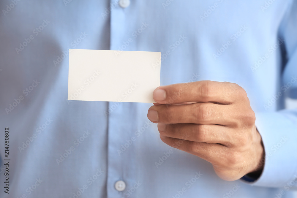Man with business card, closeup Man with business card, closeup