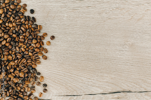  coffee beans on wooden background