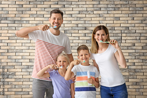 Family brushing teeth again...