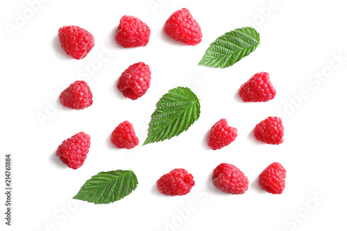 Delicious ripe raspberries with leaves on white background, top view