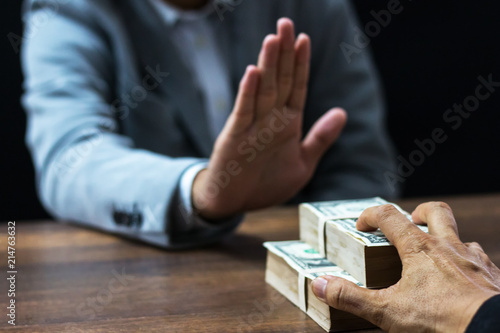 Businessman refusing money  - anti bribery and corruption concepts,Business corruption concept