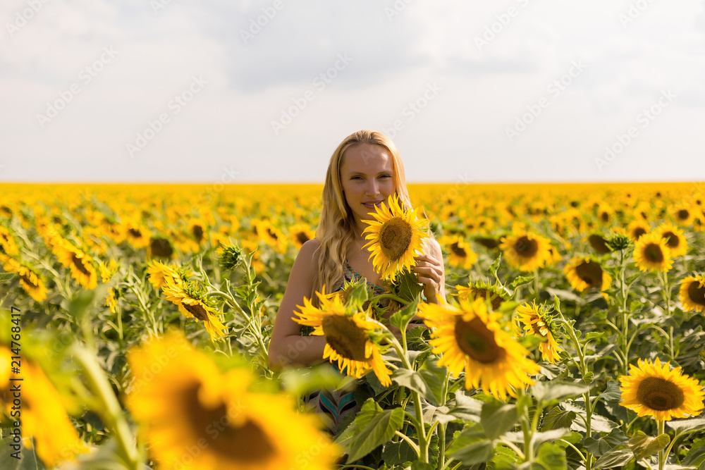Model in sunflower field Model in sunflower field