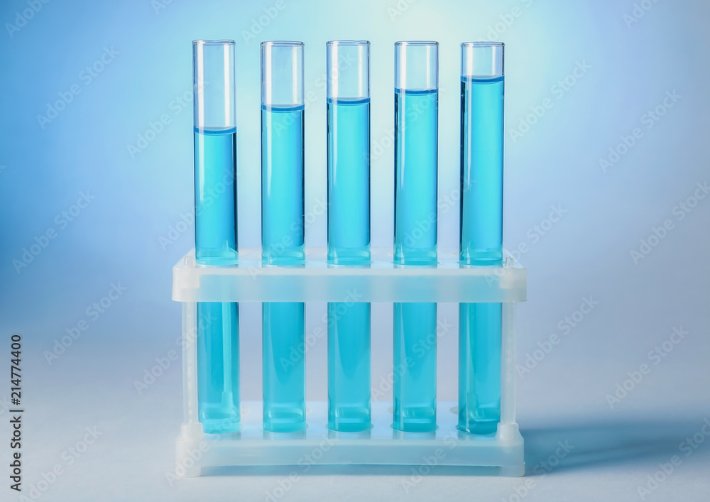 Holder with test tubes on color background Holder with test tubes on color background