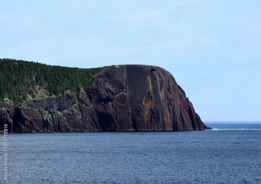 view across the bay towards the Majestic landmark Red Head Cliff; Flatrock, NL Canada view across the bay towards the Majestic landmark Red Head Cliff; Flatrock, NL Canada