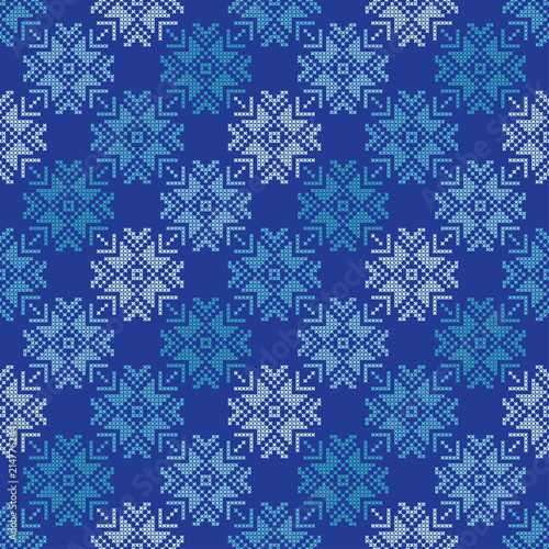 Cross stitch Norwegian snowflakes. Seamless vector background. Folk motives. Winter pattern. Textile rapport.