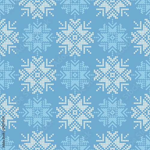 Cross stitch Norwegian snowflakes. Seamless vector background. Folk motives. Winter pattern. Textile rapport.