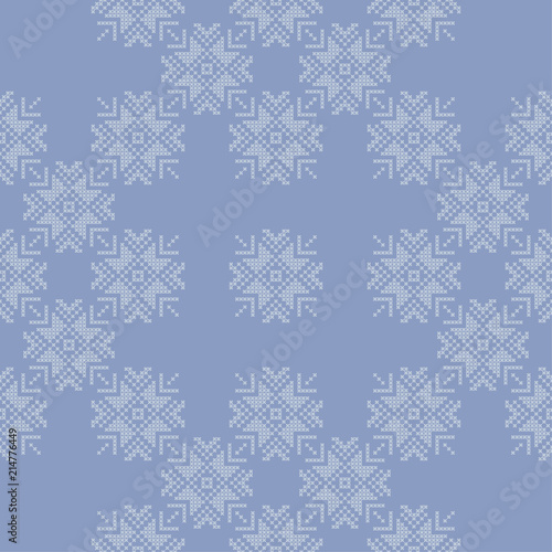Cross stitch Norwegian snowflakes. Seamless vector background. Folk motives. Winter pattern. Textile rapport.