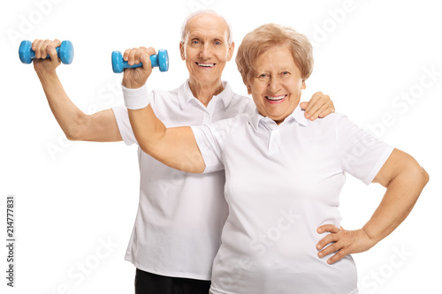 Elderly couple exercising with dumbbells