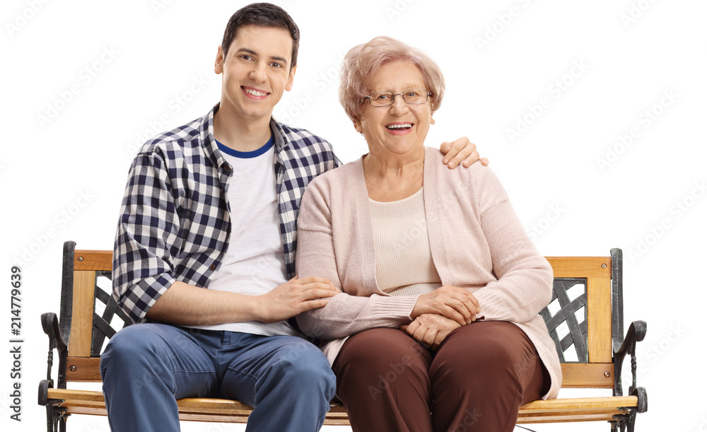 Obraz premium Young man and an elderly woman sitting on a bench