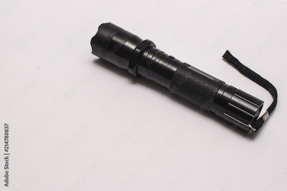 Flashlight, a black flashlight on white background Flashlight, a black flashlight on white background
