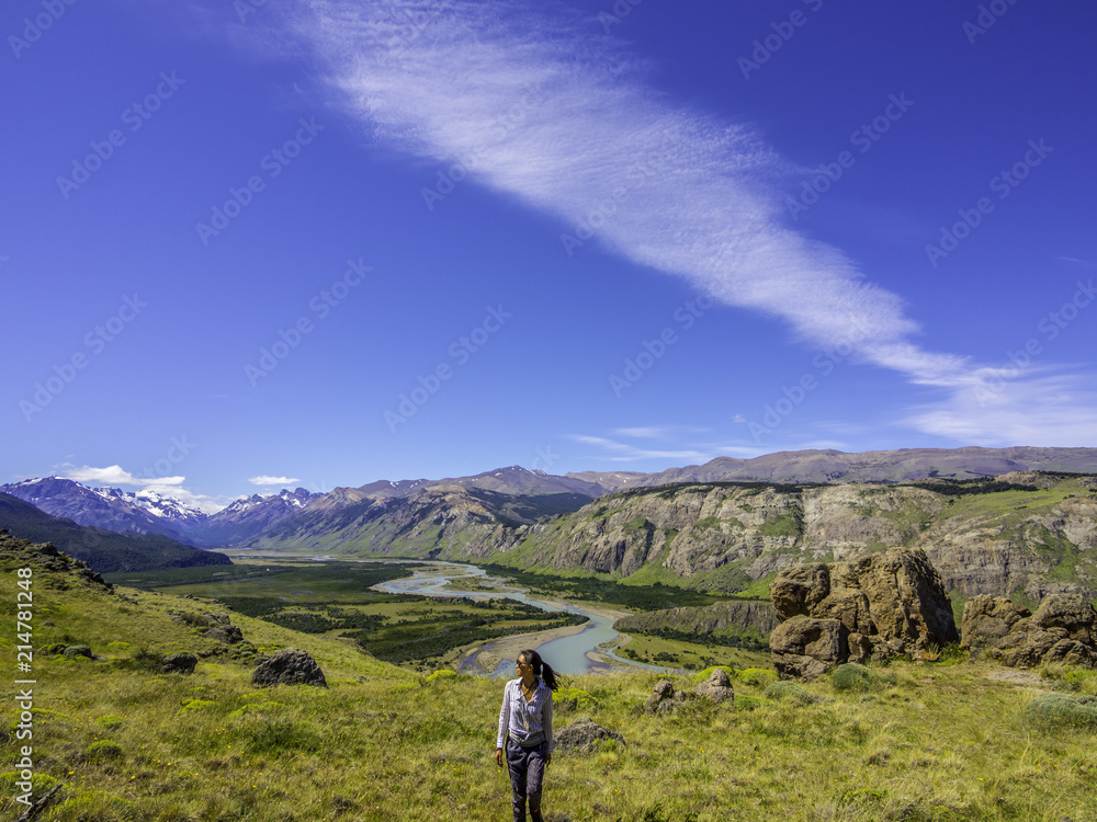 Woman traveler enjoying the scenery of Patagonia on a hike