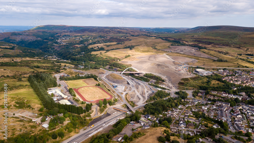 Aerial drone view of a large new bridge construction and major roadworks in Wales