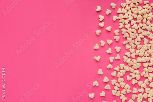 Wallpaper Mural Top view of cereals in heart form on pink background Torontodigital.ca