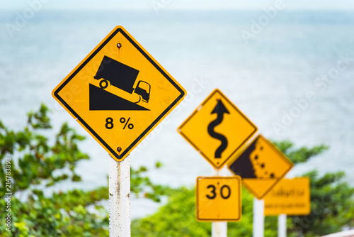 Steep Hill Descent Use Low Gear Traffic Sign on the Road in Thailand.