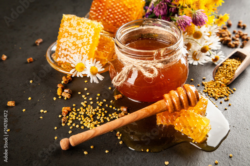 Honey jar and dipper photo