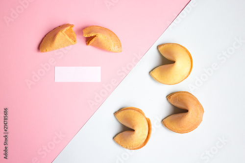 fortune cookie on pink and blue background, pastel colors, a blank page
