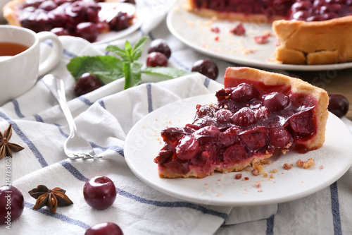 Piece of delicious cherry pie on plate