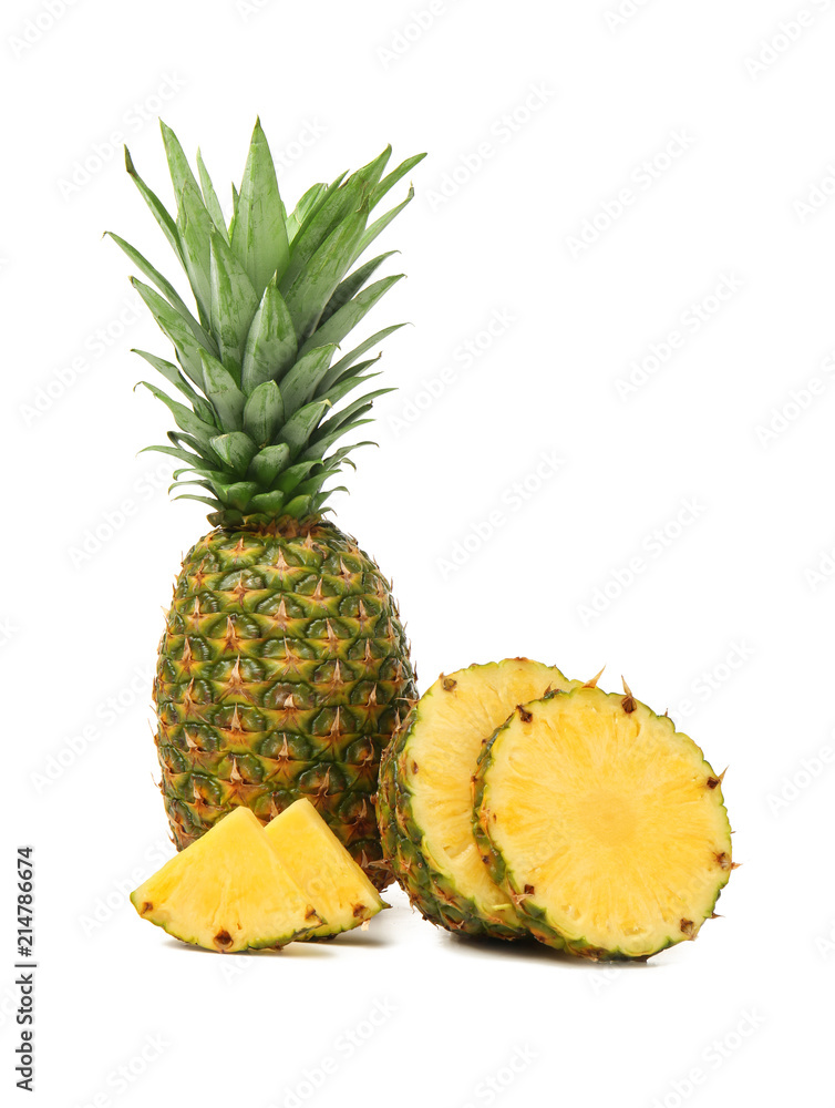 Delicious cut and whole pineapples on white background Delicious cut and whole pineapples on white background
