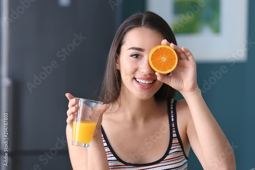 Young woman with glass of f...