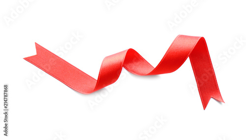 Curled red ribbon on white background