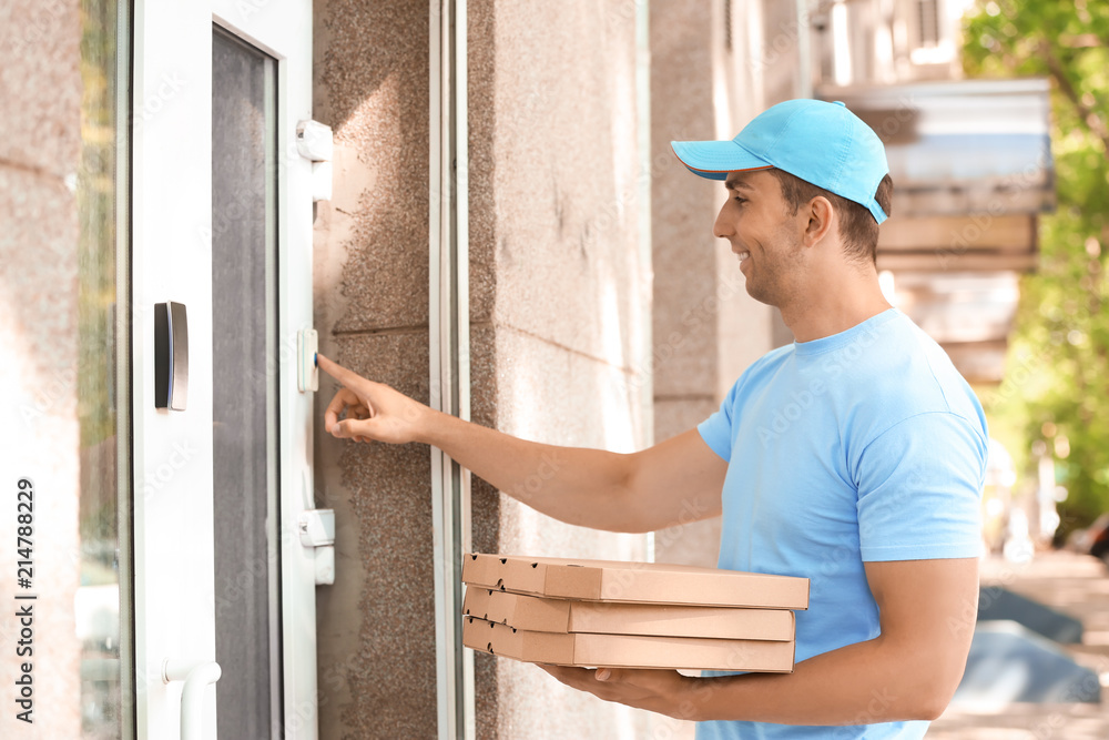 custom made wallpaper toronto digitalYoung man with pizza boxes ringing doorbell outdoors. Food delivery service