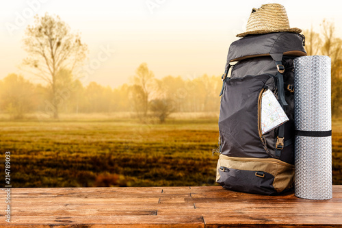 Backpack and autumn background of free space 