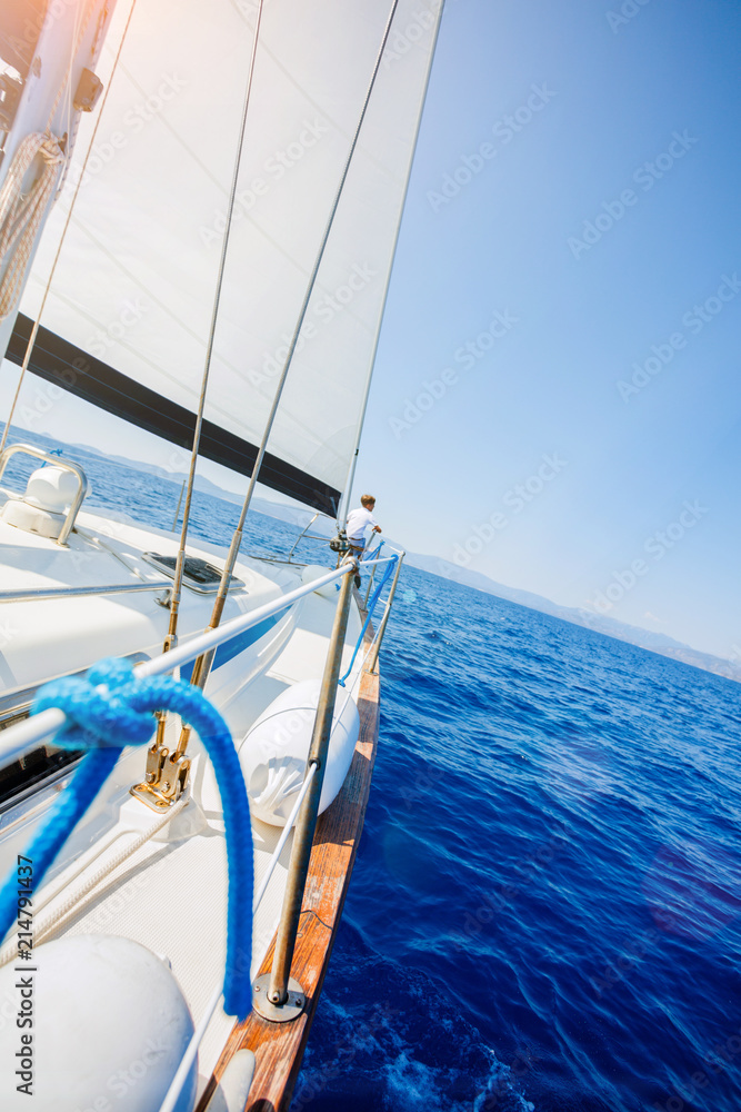 Fototapeta premium Sailing. Ship yachts with white sails in the open Sea.
