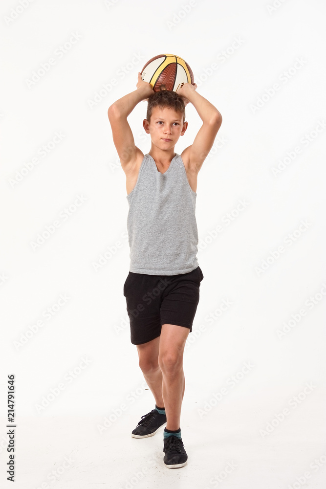 teenager with a basketball on a white background. teenager with a basketball on a white background.