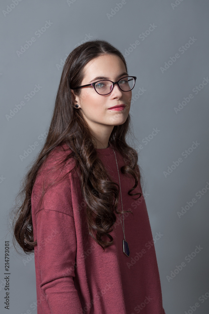 Portrait of happy nice schoolgirl teenager on gray background Portrait of happy nice schoolgirl teenager on gray background