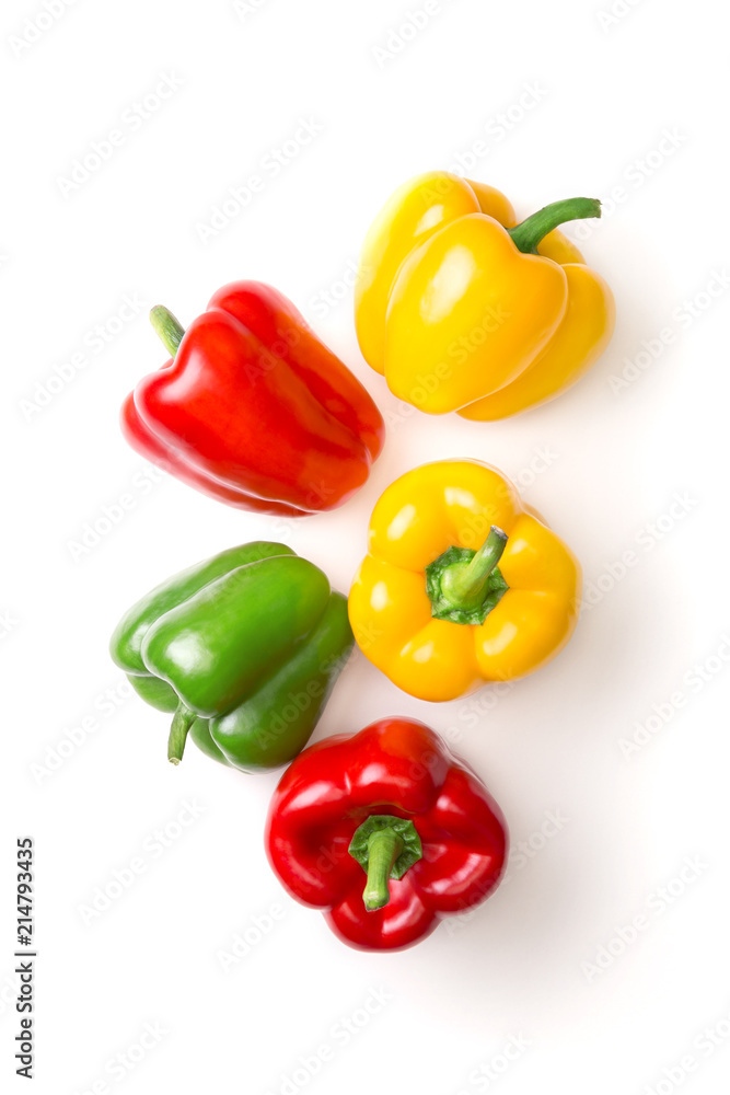 Variation of different color bell peppers on a white background. Colorful paprikas viewed from above isolated on white. Top view Variation of different color bell peppers on a white background. Colorful paprikas viewed from above isolated on white. Top view