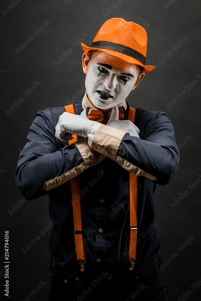 Fototapeta premium Frightened male mime, isolated on black. Lively emotions of an actor performing a pantomime