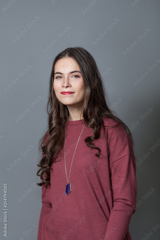 Portrait of happy nice schoolgirl teenager on gray background Portrait of happy nice schoolgirl teenager on gray background