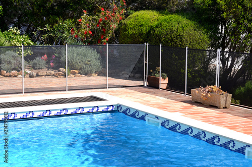 Swimming pool with safety fence