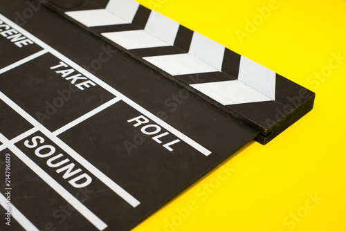Movie clapper on a yellow background