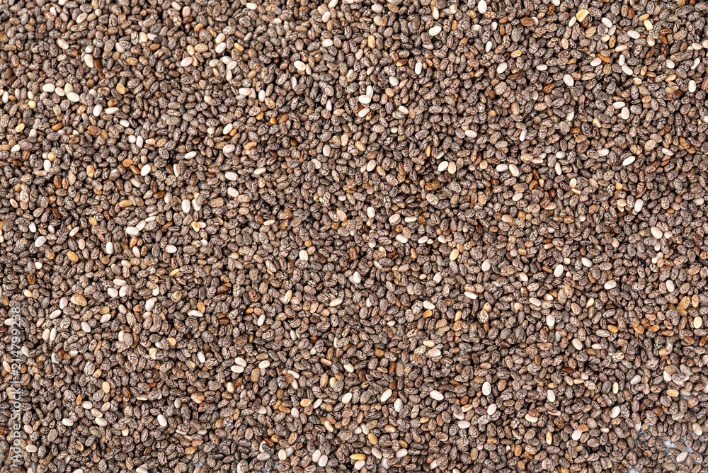 Chia seeds background. Close up chia seeds texture as superfood, organic and healthy food concept. Chia seeds top view background. Chia seeds background. Close up chia seeds texture as superfood, organic and healthy food concept. Chia seeds top view background.