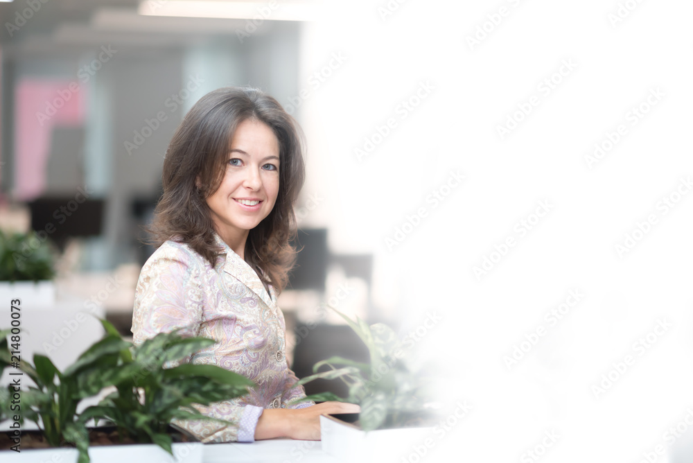 Modern business woman in the office with copy space Modern business woman in the office with copy space