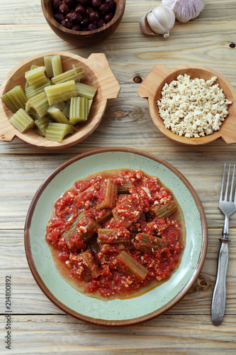 cardi o cardoni in salsa di pomodoro e tofu con spezie varie  photo