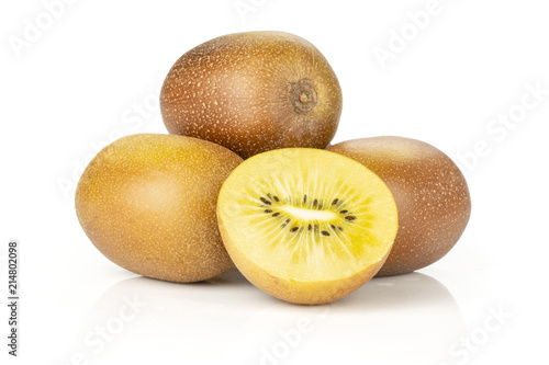 Lot of whole one half of fresh golden brown kiwi fruit sungold variety stack isolated on white