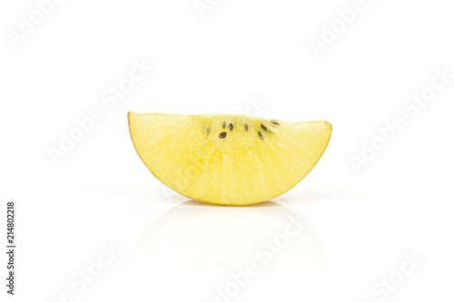 One slice of fresh golden brown kiwi fruit sungold variety isolated on white