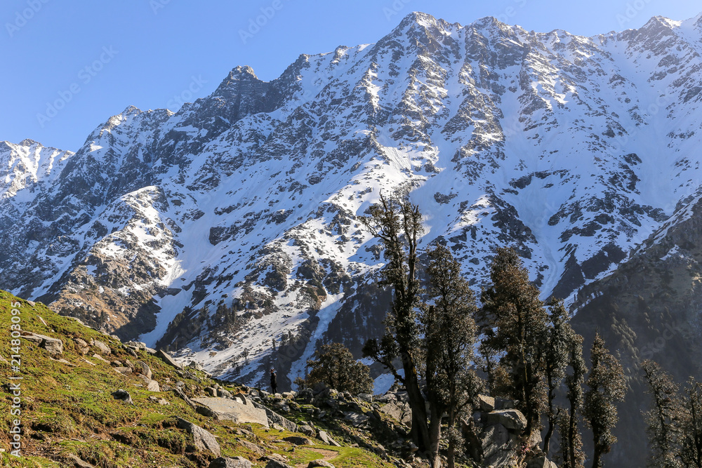 Beautiful view of mountains in snow at Triund hill top, Snow Line, Mcleod ganj, Dharamsala, India.