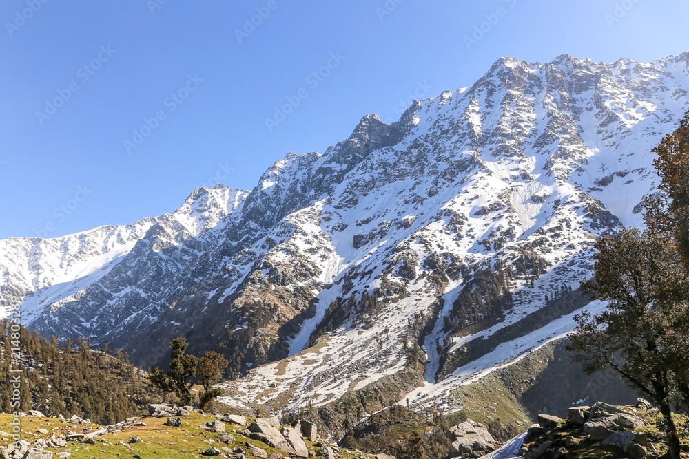Beautiful view of mountains in snow at Triund hill top, Snow Line, Mcleod ganj, Dharamsala, India.