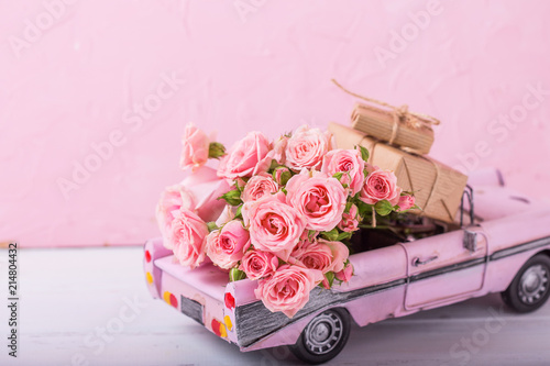 Retro car toy with pink ros...