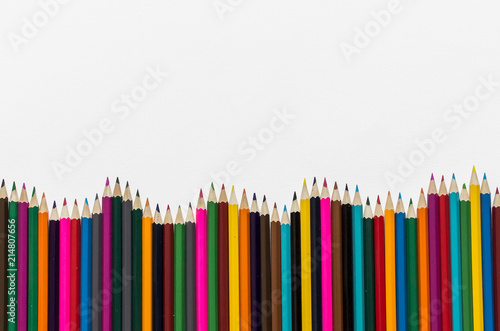 Color pencils isolated on white background. Close-up, top view, copy space.