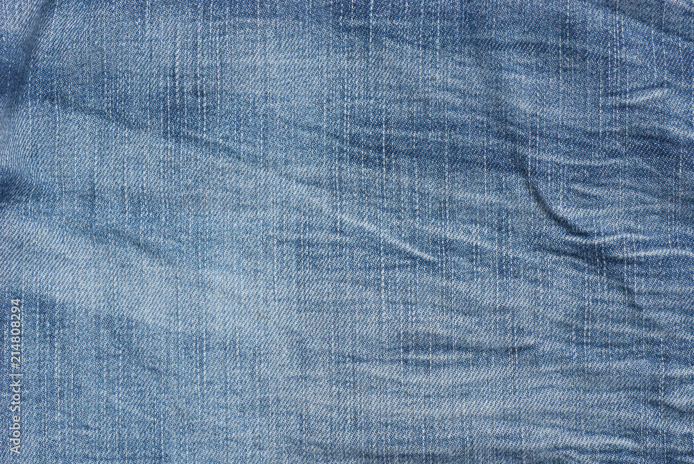 creased blue denim fabric background texture creased blue denim fabric background texture