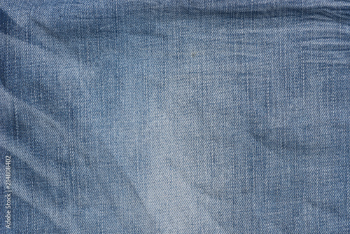 creased blue denim fabric background texture